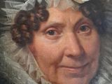 painting of a woman in a white dress and a white hat