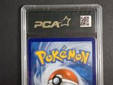 a close up of a pokemon card in a plastic case