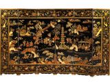an image of a black and gold decorated screen with birds and flowers