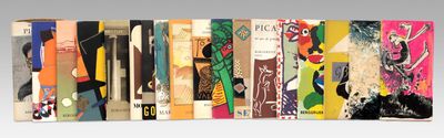 a lot of books that are lined up on a shelf
