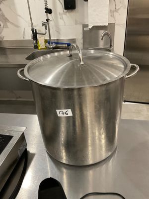 a large pot sitting on top of a stove in a kitchen