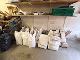 a room with a lot of bags of stuff on the floor