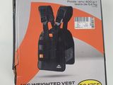 packaging of a black and orange baby carrier in a box on a white surface