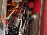 a metal box with tools in it on the floor