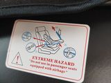 an extreme hazard sign on the seat of a motorcycle