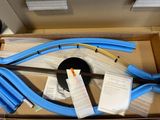 a box with a bunch of blue hoses inside of it