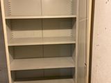 an image of an empty refrigerator in the corner of a room