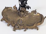 a statue of a man riding a horse on top of a plaque