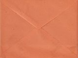 an envelope with a brown paper inside on a white background