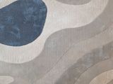 a rug that has a blue and brown design on it