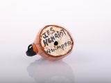 a picture of a brown and black pipe with writing on it
