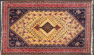 an oriental rug with a diamond design on a black ground