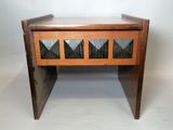 an image of a small wooden table with glass inserts