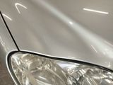 a close up of a car ' s headlight on the front of the car