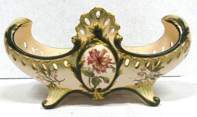 a vase that has a flower on it on a stand