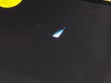 a black laptop with a yellow disk on the screen