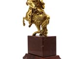 bronze statue of a man on a horse on a marble base