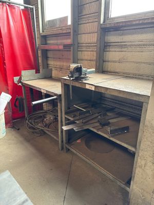 an image of a workbench in a building with a red curtain