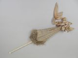 a small umbrella with a bow on it on a white surface