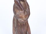 wooden statue of a woman holding a basket of flowers on a white background