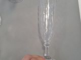 a person that is holding a wine glass on a table