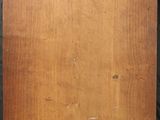 an old picture of a piece of wood with a label on it