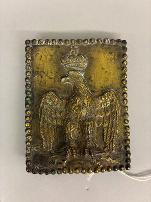an image of a metal plaque with a bird on it