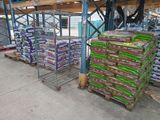 many bags of food sitting on the pallets in the warehouse