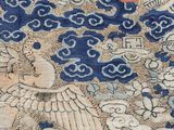 an image of a blue and white oriental rug with a bird on it