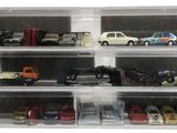 a display case with a lot of toy cars in it