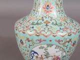 an image of a blue vase with a gold rim on a gray background