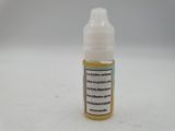 a close up of a bottle of liquid on a white surface