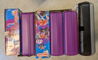 purple suitcases are lined up in a row on the floor