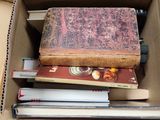 a box full of books sitting on top of a table