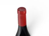 a bottle of wine that is sitting on a table