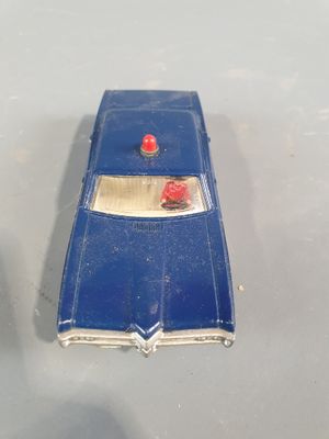 a blue toy car that is sitting on a table