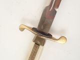 a close up of a knife on a white surface