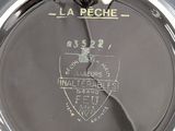 a close up of a watch with a black face