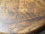 a close up of a piece of wood with the word on it