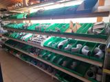 many different types of pipes and fittings on the shelves