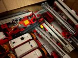 a box full of toy firetrucks and other toys