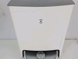 an image of a white toilet with a black lid and a gray lid