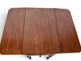 a close up of a wooden table with four legs on a white background