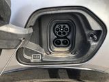 a close up of a car ' s fuel tank with a car plugged into it
