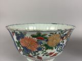a close up of a bowl on a table with a white background