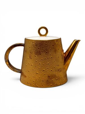 an image of a gold teapot on a white background
