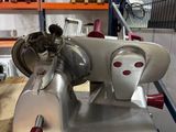 a machine that is sitting on a table in a warehouse