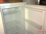an open refrigerator that is sitting in a kitchen