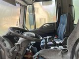 a truck that has been vandalized and is sitting in the mud