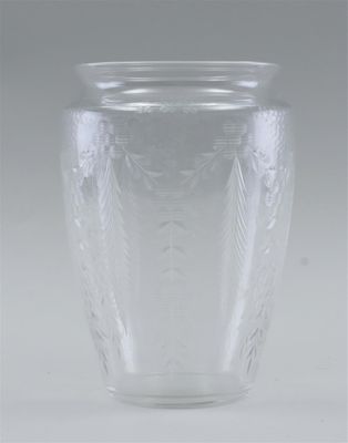 a clear glass vase sitting on a white surface